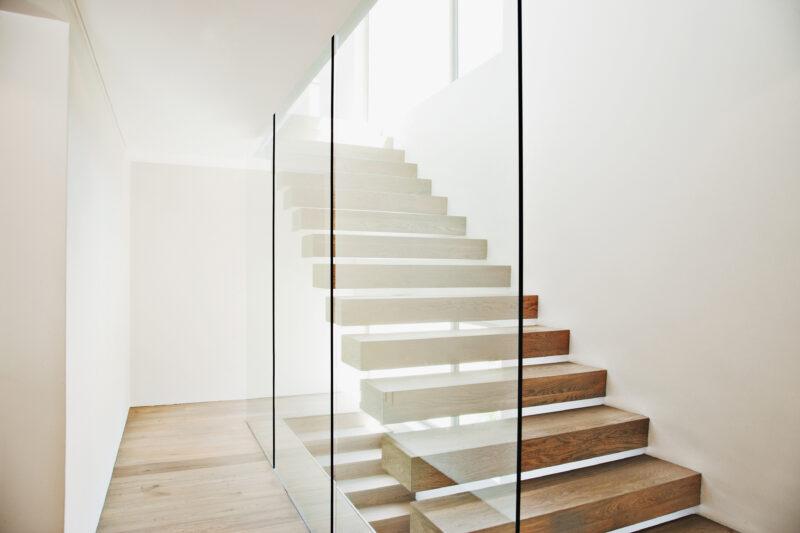 Floating staircase and glass walls balaustrades in modern house