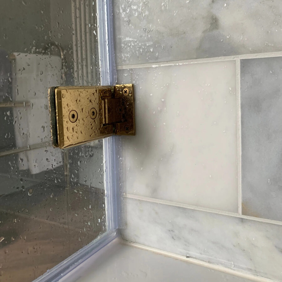 Bath Screen Brass Hinge Closeup