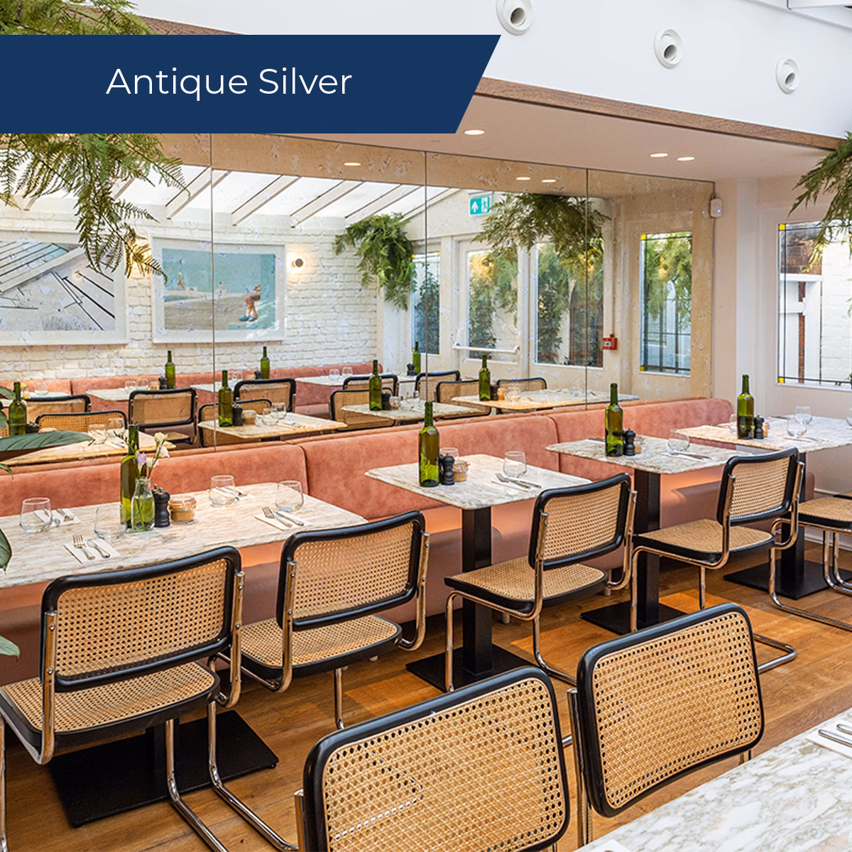 Antique silver mirror on the wall of a restaurant