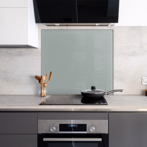 Jade Green Painted Kitchen Splashback on the wall behind a modern stove.