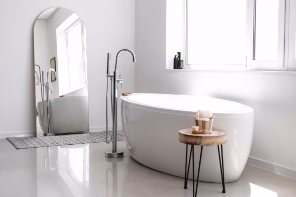 Interior of light bathroom with big mirror