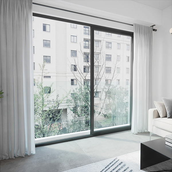 A frameless glass balustrade afixed to the outside of a high-rise building - perspective looking outside from the interior of the apartment.